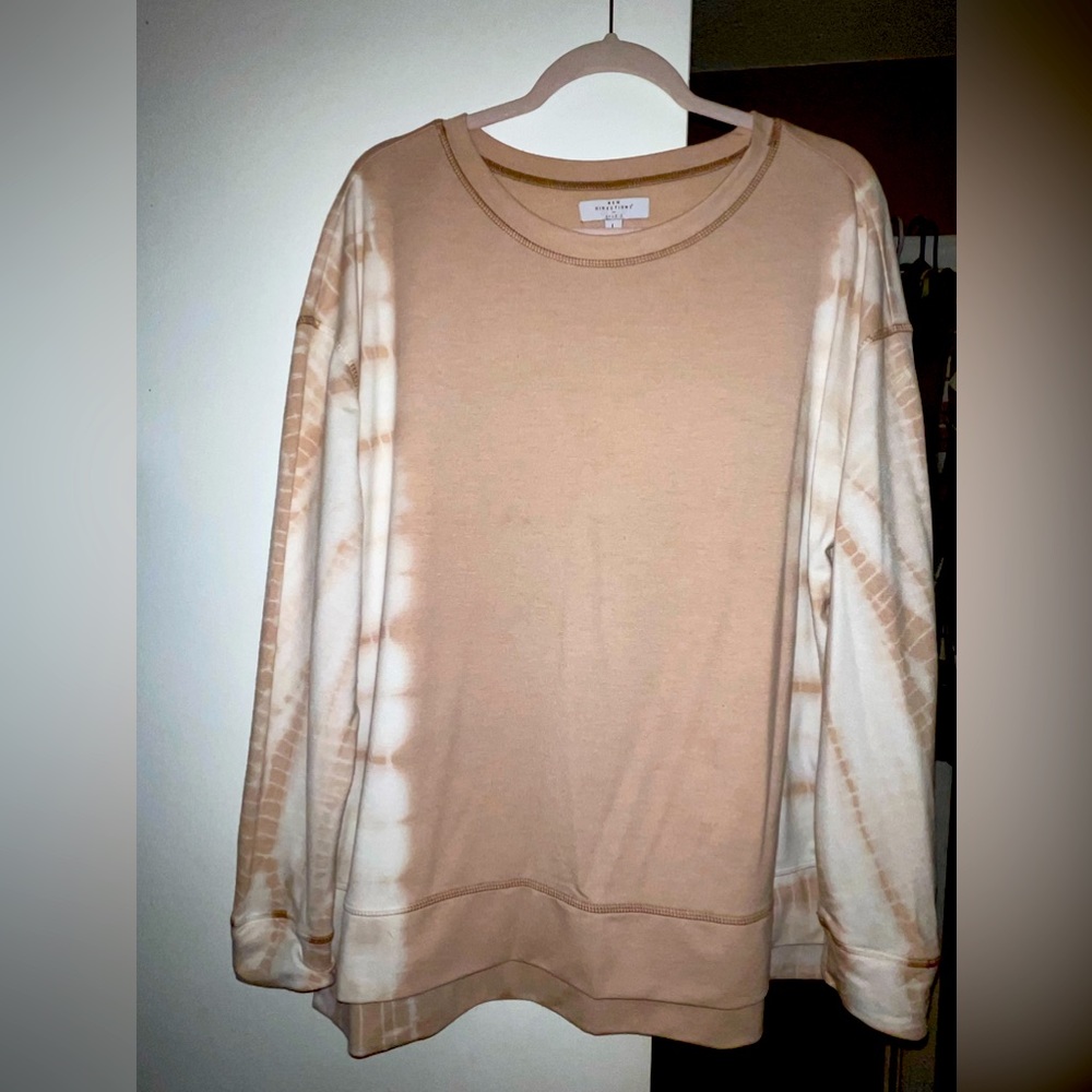 Soft blush pink sweatshirt with tie-dye details